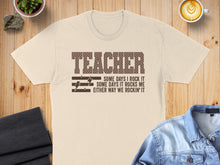 Load image into Gallery viewer, T-shirt with "TEACHER SOME DAYS I ROCK IT SOME DAYS IT ROCKS ME EITHER WAY WE ROCKIN' IT" text.