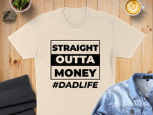 Load image into Gallery viewer, Cream t-shirt with black text "STRAIGHT OUTTA MONEY #DADLIFE".
