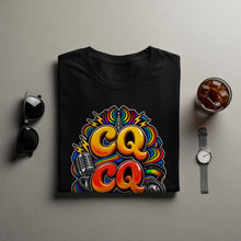 Load image into Gallery viewer, Black t-shirt with colorful "CQ CQ" graphic featuring microphone and radio dial.