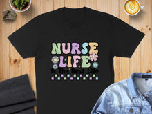 Load image into Gallery viewer, Black t-shirt with pastel wavy text "Nurse Life Is The Best Life" and flowers.
