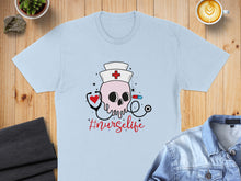 Load image into Gallery viewer, Light blue t-shirt with skull nurse graphic and "#nursecrunch" text.