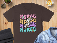 Load image into Gallery viewer, Brown t-shirt with "Nurse" text in colorful lightning bolt and floral design.