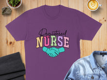 Load image into Gallery viewer, Purple t-shirt with "Registered Nurse" in colorful lettering and two hands shaking.