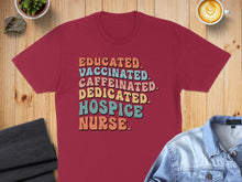 Load image into Gallery viewer, Burgundy t-shirt with "Educated. Vaccinated. Caffeinated. Dedicated. Hospice Nurse." text.