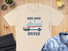 Load image into Gallery viewer, Cream t-shirt with "WEE WOO DRIVER" text and a cartoon ambulance.