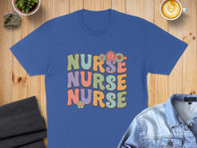 Load image into Gallery viewer, Blue t-shirt with "Nurse Nurse Nurse" in colorful retro font and flowers.