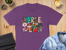 Load image into Gallery viewer, Purple t-shirt with "Nurse Life" text and medical icons.