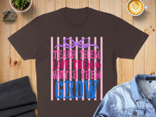 Load image into Gallery viewer, T-shirt with text "Teach Them Love Them Watch Them Grow" in pink and blue stripes.