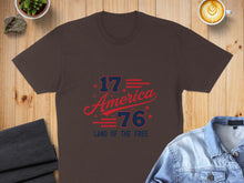 Load image into Gallery viewer, Brown t-shirt with red and blue "1776 America Land of the Free" graphic.