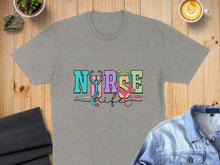 Load image into Gallery viewer, Gray t-shirt with colorful "Nurse Life" text and stethoscope graphic.
