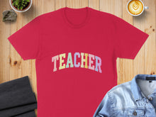 Load image into Gallery viewer, Red t-shirt with "TEACHER" in pastel rainbow lettering.