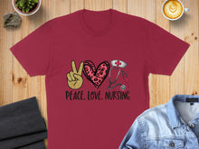 Load image into Gallery viewer, Maroon t-shirt with peace sign, stethoscope, heart, and text "PEACE. LOVE. NURSING."