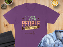 Load image into Gallery viewer, Purple t-shirt with "I stab people for a living #nurselife" text and a syringe graphic.