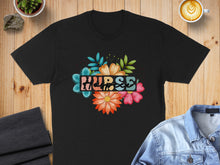 Load image into Gallery viewer, Black t-shirt with colorful floral "Nurse" graphic.