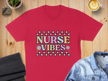 Load image into Gallery viewer, Red t-shirt with "Nurse Vibes" in colorful, pixelated text.
