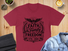 Load image into Gallery viewer, Maroon t-shirt with black "Faith & Family & Freedom 1776-2026" graphic.