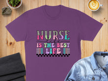 Load image into Gallery viewer, Purple t-shirt with "Nurse Life Is The Best Life" text in colorful, bubbly font.