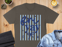 Load image into Gallery viewer, Brown t-shirt with blue stripes and "Enn Yay" text and star accents.