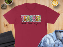 Load image into Gallery viewer, Maroon t-shirt with "TEACHER" in colorful leopard print and "teach love inspire" below.