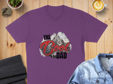 Load image into Gallery viewer, Purple t-shirt with "The Cool Dad" text and mountain graphic.