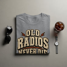 Load image into Gallery viewer, Grey t-shirt with distressed "OLD RADIOS NEVER DIE" text and lightning graphics.