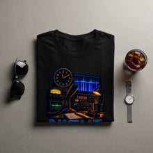Load image into Gallery viewer, Black t-shirt features a radio setup with a clock, microphone, and frequency display.