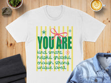 Load image into Gallery viewer, White t-shirt with colorful stripes and text "YOU ARE kind, smart, helpful, grateful, enough, strong, unique, loved."