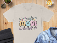 Load image into Gallery viewer, Wife Mom Nurse text with hearts and flowers on a beige t-shirt.