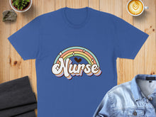 Load image into Gallery viewer, Blue t-shirt with retro rainbow and "Nurse" text graphic.