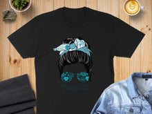 Load image into Gallery viewer, Black t-shirt with messy bun nurse graphic and teal bandana.