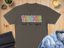 Load image into Gallery viewer, Gray t-shirt with "TEACHER" in colorful polka dot letters and "teach love inspire" below.