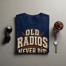Load image into Gallery viewer, Navy t-shirt with distressed text reading "OLD RADIOS NEVER DIE".