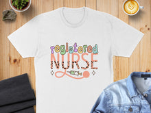 Load image into Gallery viewer, White t-shirt with "Registered Nurse" in colorful, playful font and a syringe graphic.