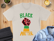 Load image into Gallery viewer, Beige t-shirt with "BLACK FATHER" text and raised fist graphic.