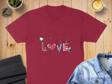 Load image into Gallery viewer, Burgundy t-shirt with "love" design featuring stethoscope, heart, syringe, and pills.