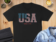 Load image into Gallery viewer, Black t-shirt with "USA SINCE 1776" in distressed flag print.