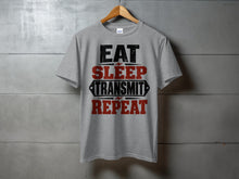 Load image into Gallery viewer, Grey t-shirt with text "EAT SLEEP TRANSMIT REPEAT"