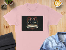Load image into Gallery viewer, Pink t-shirt with "Est. 1776 Independence Day" graphic featuring American flags.