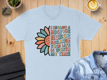 Load image into Gallery viewer, Light blue t-shirt with "I became a hospice nurse because your life is worth my time" text and flower graphic.