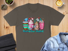 Load image into Gallery viewer, T-shirt graphic: coffee cups with "RCA Resident Care Assistant" and medical icons.