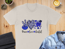 Load image into Gallery viewer, T-shirt with "Peace Love Dental" text and dental graphics, including a peace sign and tooth.