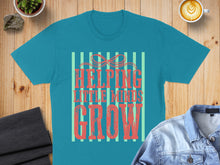 Load image into Gallery viewer, Teal t-shirt with "Helping Little Minds Grow" text and stripes.