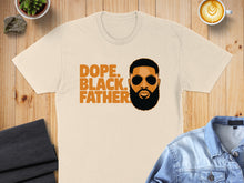 Load image into Gallery viewer, Cream t-shirt with "Dope. Black. Father." text and graphic of a man's face.