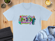 Load image into Gallery viewer, "One Spooky Nurse" graphic on a light blue t-shirt with Halloween elements.