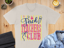 Load image into Gallery viewer, Tired Teachers Club design with apple and pencil graphics on a t-shirt.