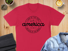 Load image into Gallery viewer, Red t-shirt with "Land of the Free Since 1776 Because of the Brave" text.