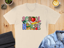 Load image into Gallery viewer, Cream t-shirt with "School Nurse" text featuring school and medical icons.