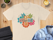 Load image into Gallery viewer, T-shirt with "Hospice" text surrounded by colorful floral graphics.