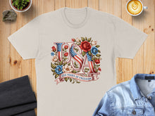 Load image into Gallery viewer, Cream t-shirt with "USA" in floral letters and "250 Years of Freedom" ribbon.