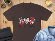 Load image into Gallery viewer, Brown t-shirt with peace sign, heart, and syringe design and "Peace Love Phlebotomy" text.